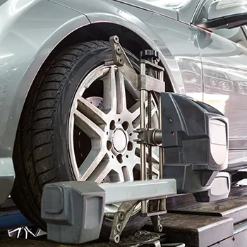 Car wheel alignment service in progress